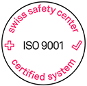 White round label with red text "swiss safety center certified system." In the center, "ISO 9001" with a red cross on the left and a checkmark on the right.